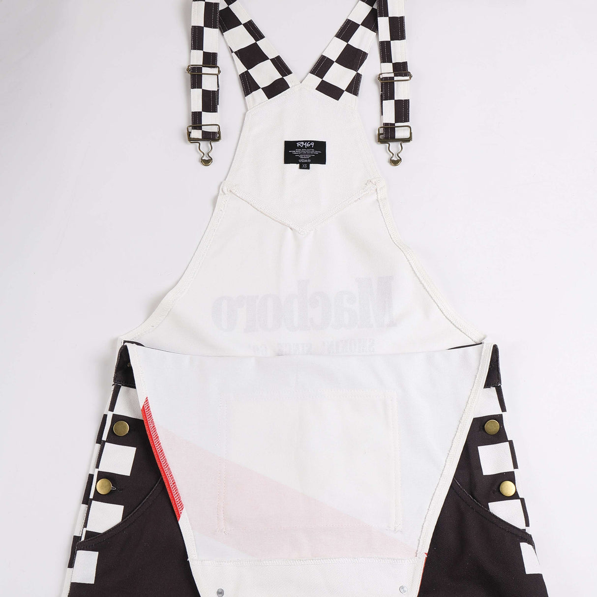 Macboro Overalls featuring black and white checkered straps and black pocket accents, designed for durability and style with a bold look