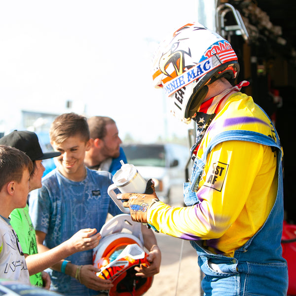 RonnieMAc Signing Merchandise at an event