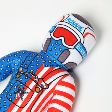 Cute Lil Ronnie Merica plush doll in red, white, and blue design, wearing a racing helmet and star-patterned outfit.