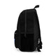 Side view of Bert Blast Ride Fast backpack showcasing sleek black design with zippered compartments and mesh pockets.