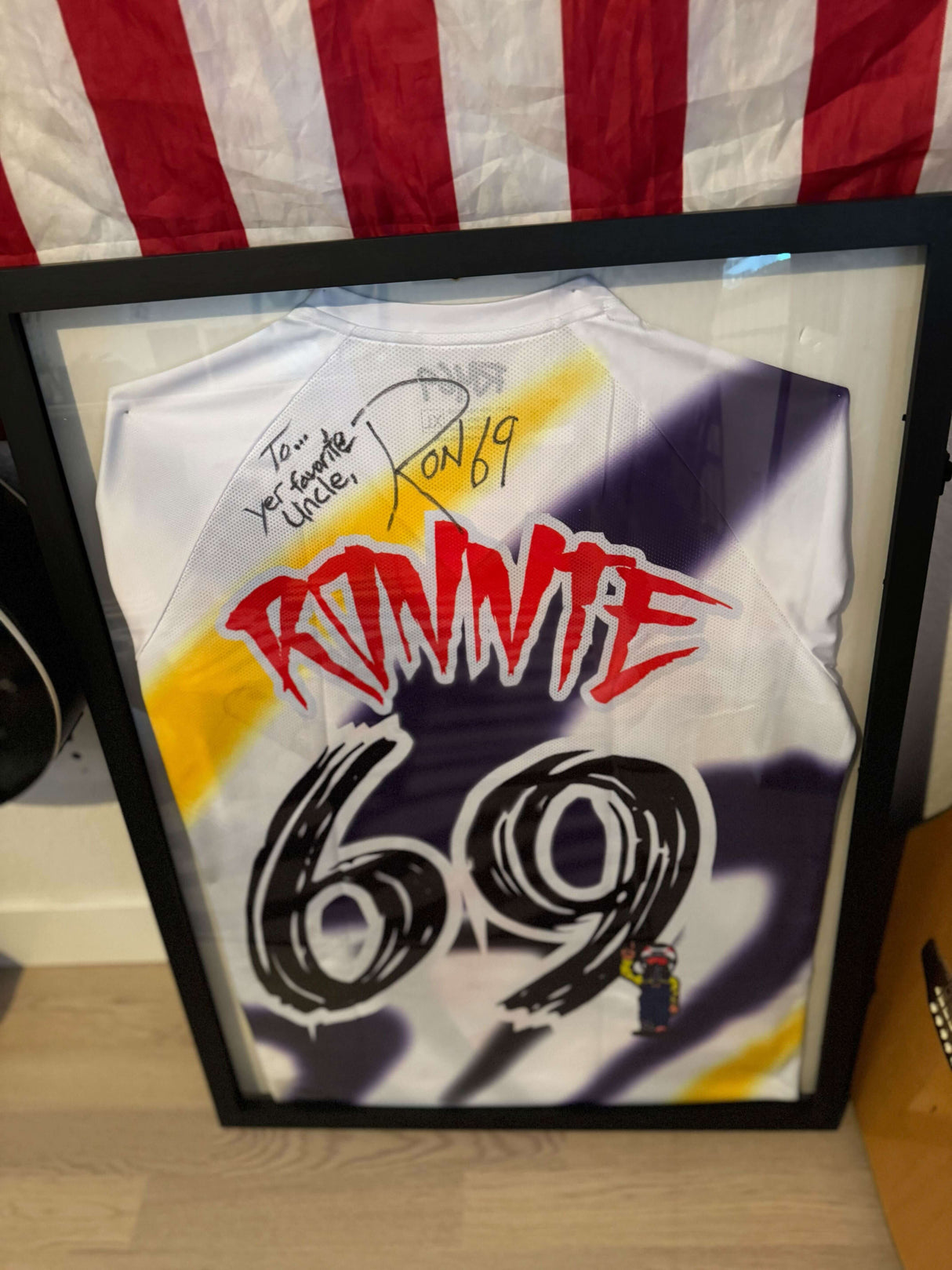 Ronnie Mac autographed limited edition jersey framed, featuring the number 69 and personalized message.