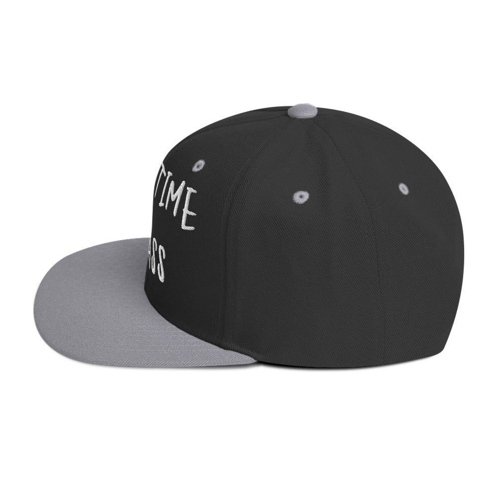 Black and gray Fulltime Badass embroidered snapback hat with flat brim, side view.