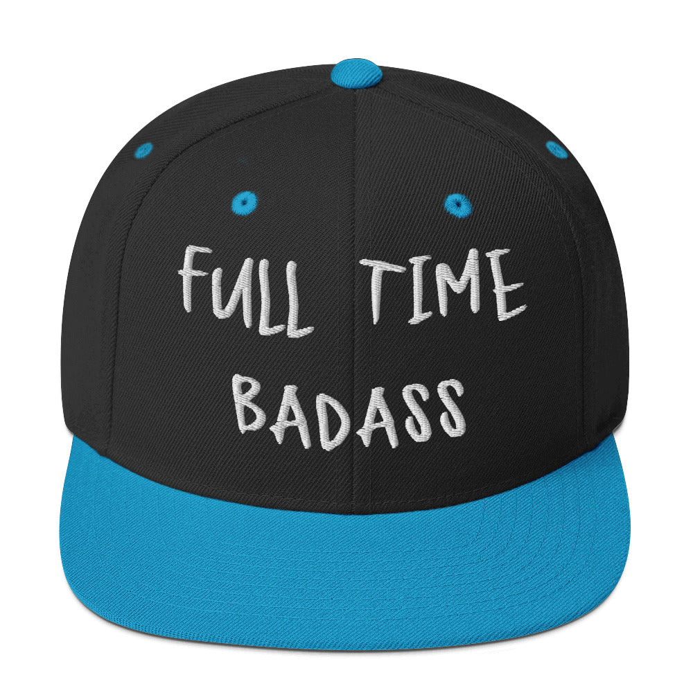 Black and blue snapback hat with "Full Time Badass" embroidered on the front, featuring a classic fit and flat brim.