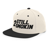 2 Still Smoking embroidered snapback hat with classic fit and flat brim, featuring bold text design from Ronnie Mac's store.