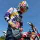 Ronnie Mac wearing the retro jersey standing by the magnum eagle at the track